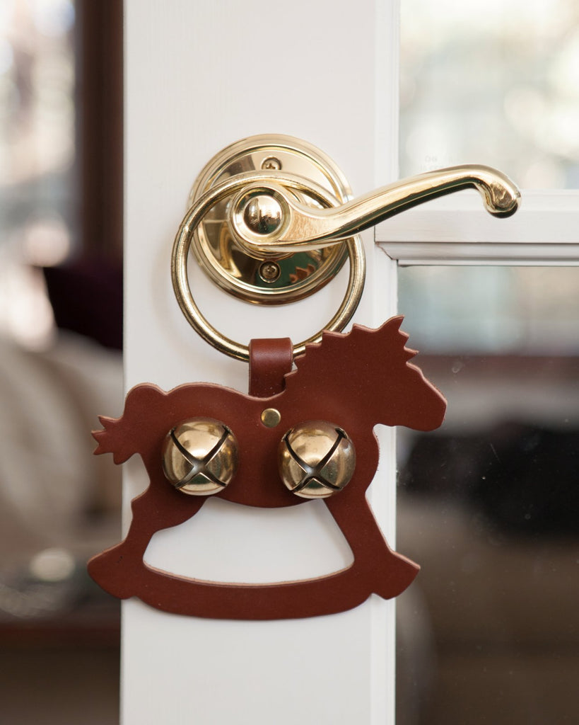 door decoration rocking horse brown gold bells