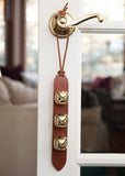 3 gold brown leather sleigh bells