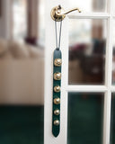 6 gold green leather sleigh bells